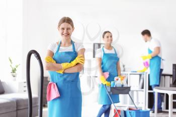 Female janitor and her team in office�