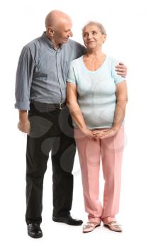 Portrait of senior couple on white background�