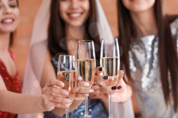 Beautiful young women drinking champagne at hen party�