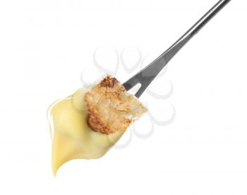 Fondue stick with cheese covered piece of bread on white background�