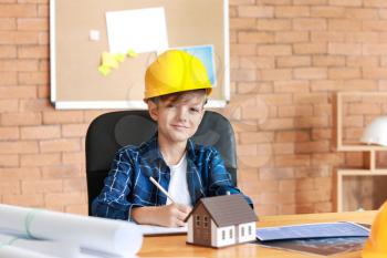 Cute little architect working in office�