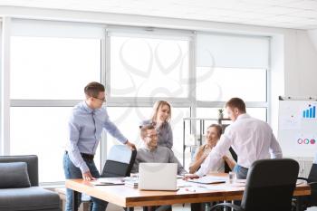 Group of young people at business meeting in office�