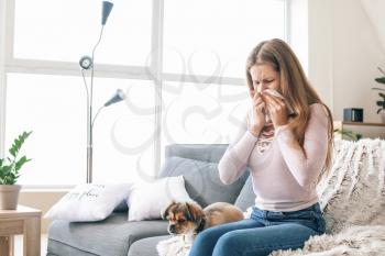 Woman suffering from pet allergy at home�
