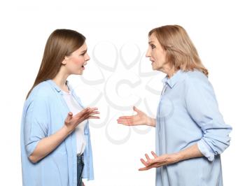 Quarreling mother and daughter on white background�