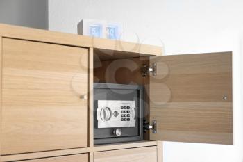 Modern small safe in cabinet�