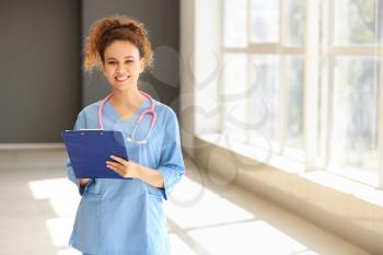 Young African-American nurse in clinic�