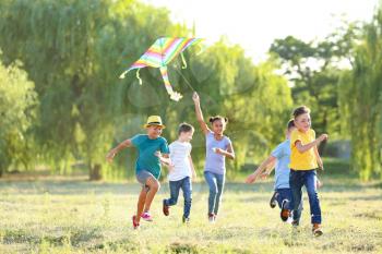 Children flying kite on summer day�