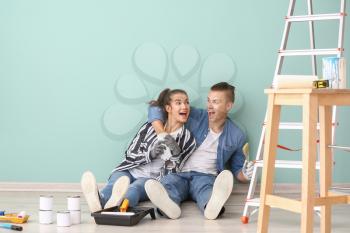 Happy young couple resting during repair of their new house�