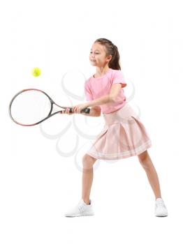 Little girl playing tennis against white background�
