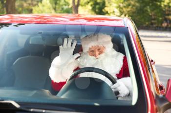 Santa Claus driving modern car, view through windscreen window�
