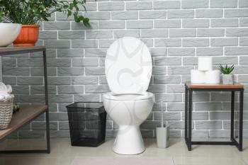 Modern toilet bowl in interior of restroom�