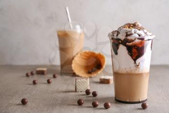 Cup of tasty frappe coffee on table�