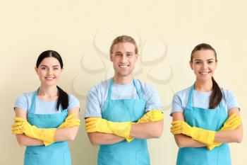 Team of janitors on light background�