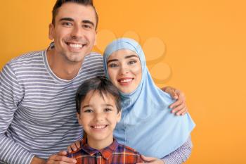 Portrait of Muslim family on color background�
