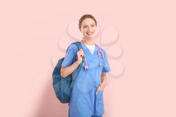 Female medical student on color background�