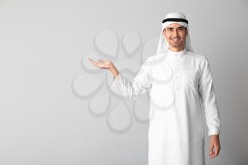 Handsome Arab man on light background�