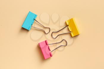 Binder clips for paper on color background�