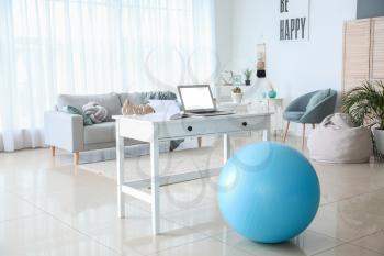 Fitness ball near workplace at home�