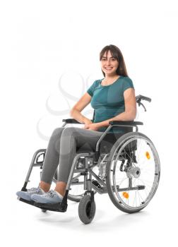Young woman in wheelchair on white background�