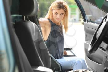 Handicapped woman getting into her car�