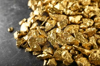 Many gold nuggets on table�