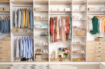 Modern wardrobe with stylish spring clothes and accessories�