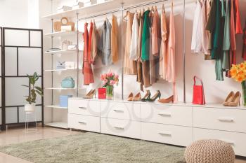 Modern wardrobe with stylish spring clothes and accessories�