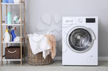 Modern washing machine in laundry room�