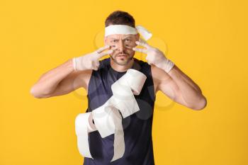 Funny man with toilet paper on color background. Concept of coronavirus epidemic�