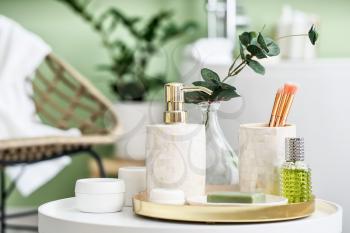 Body care cosmetics on table in bathroom�