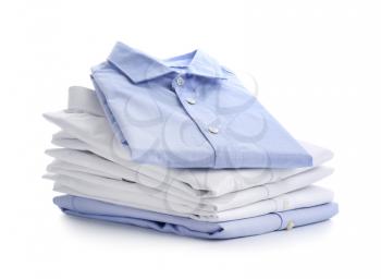 Stack of male shirts on white background�