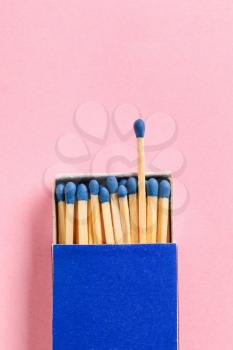 Box with matches on color background. Concept of uniqueness�