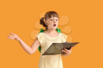 Little actress on color background�