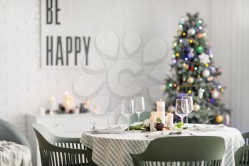 Interior of room with table set for Christmas dinner�