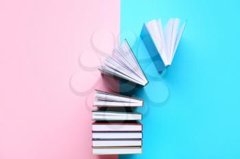 Stack of books on color background�