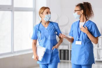 Female doctors discussing diagnosis in clinic�