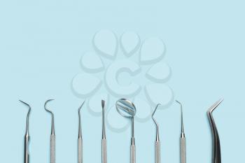 Dentist's tools on color background�