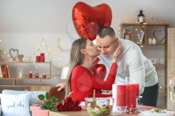 Young couple celebrating Valentine's Day at home�