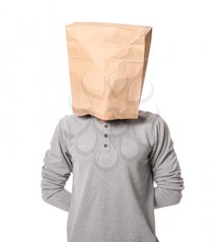 Male hostage with paper bag on white background�