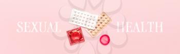 Contraceptive pills and condoms on color background. Concept of sexual health�