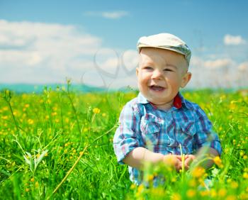 Royalty Free Photo of a Little Boy in the Meadow