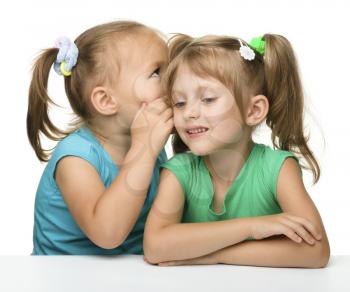 Royalty Free Photo of Two Girls Whispering