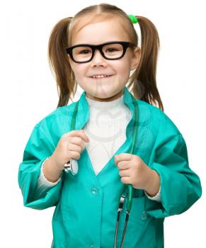 Cute little girl is playing doctor with stethoscope, isolated over white