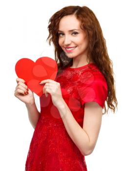 Young woman holding red heart, Valentine day concept, isolated over white