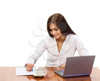 Royalty Free Photo of a Young Woman at a Desk With a Laptop