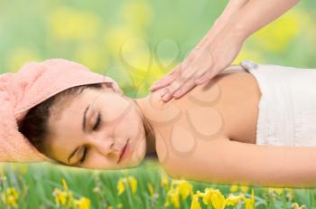 Royalty Free Photo of a Woman Getting a Massage on Grass