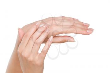 Two woman hands with moisturizer body cream isolated on white
