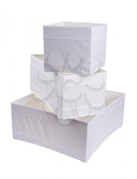 
white fabric storage boxes isolated on white