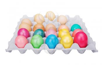 
multicolored Easter eggs in the cardboard box isolated on a white background 