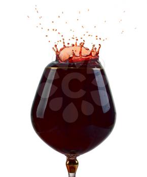 A glass of Wine with splash on white background